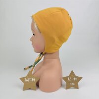 Bindemütze Löwenköpfe